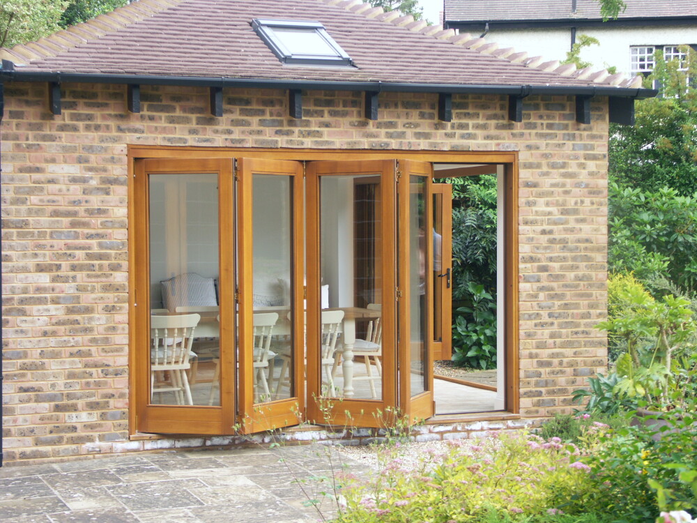 Timber Bi-Fold doors on a brick extension 