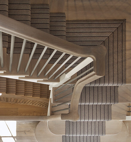 Combining Timber with Glass and Metal in Staircase Design