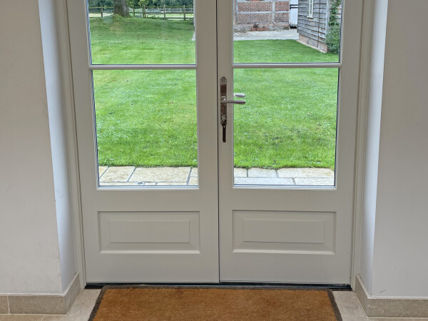 White timber and glass panelled french door