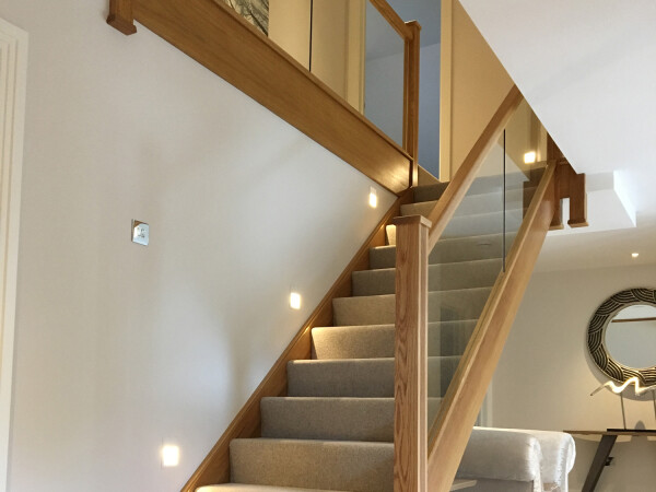 timber staircase with glass balustrade