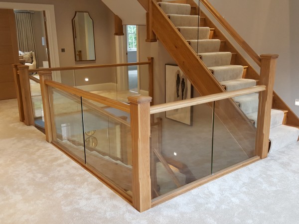 timber staircase with glass balustrade