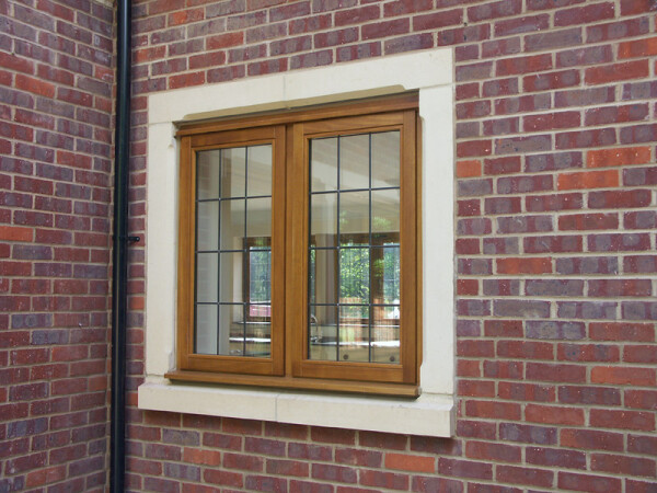 square casement window on a brick wall