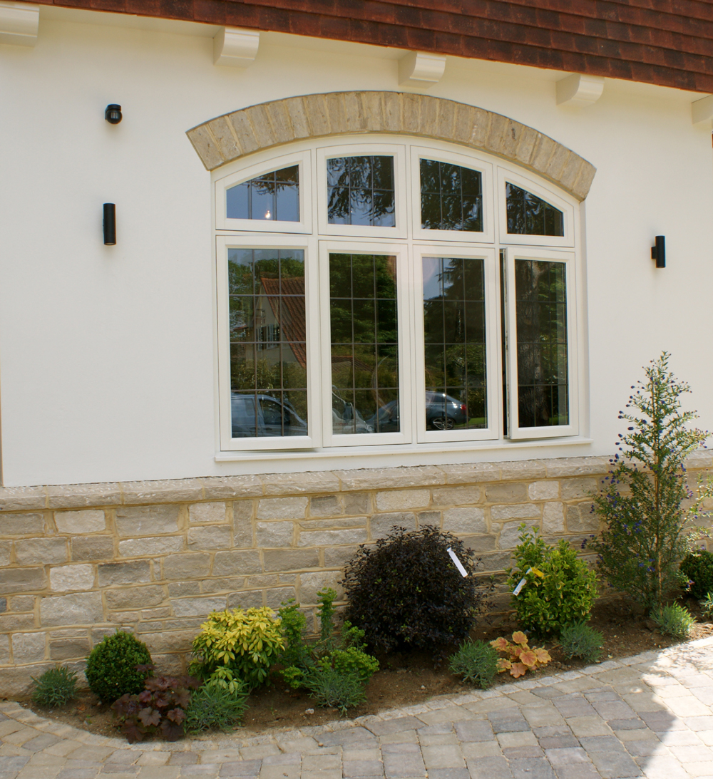 close up of curved casement window