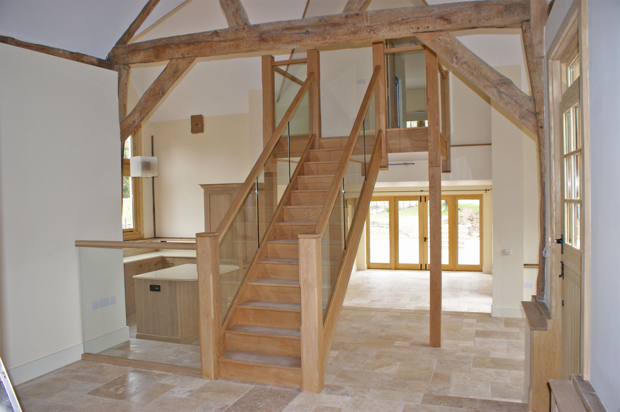 barn conversion with glass balustrade staircase