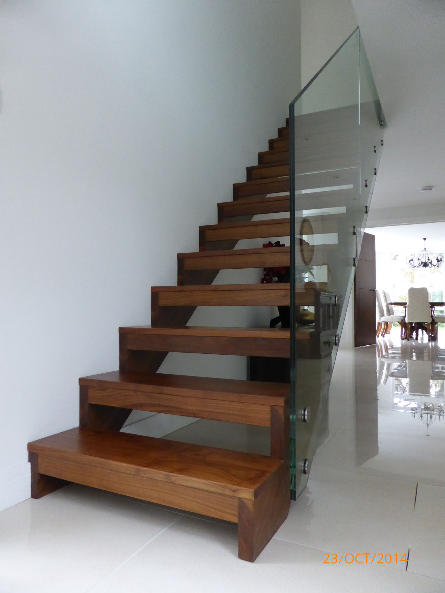 timber open tread staircase with glass balustrade