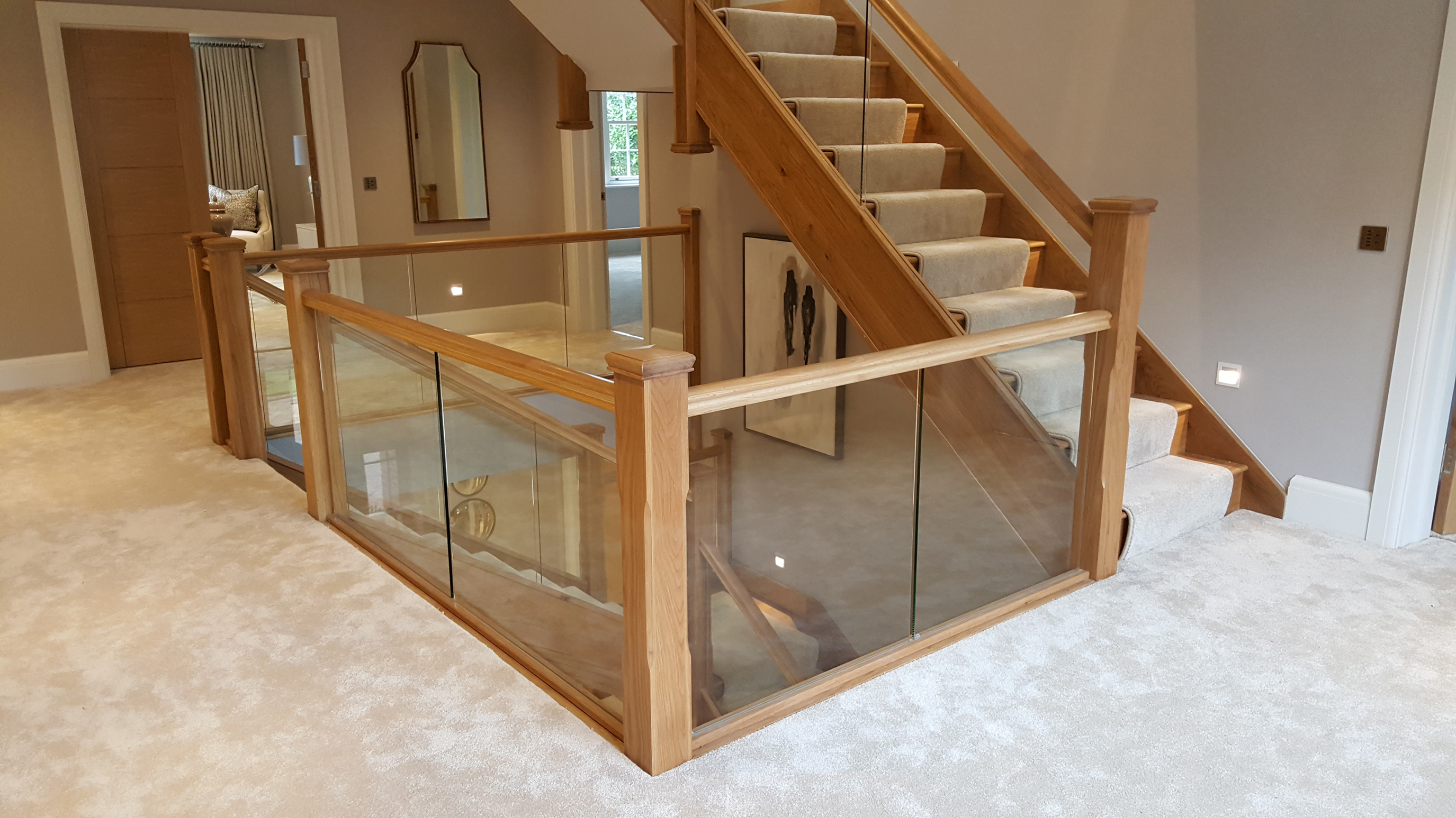 timber staircase with glass balustrade