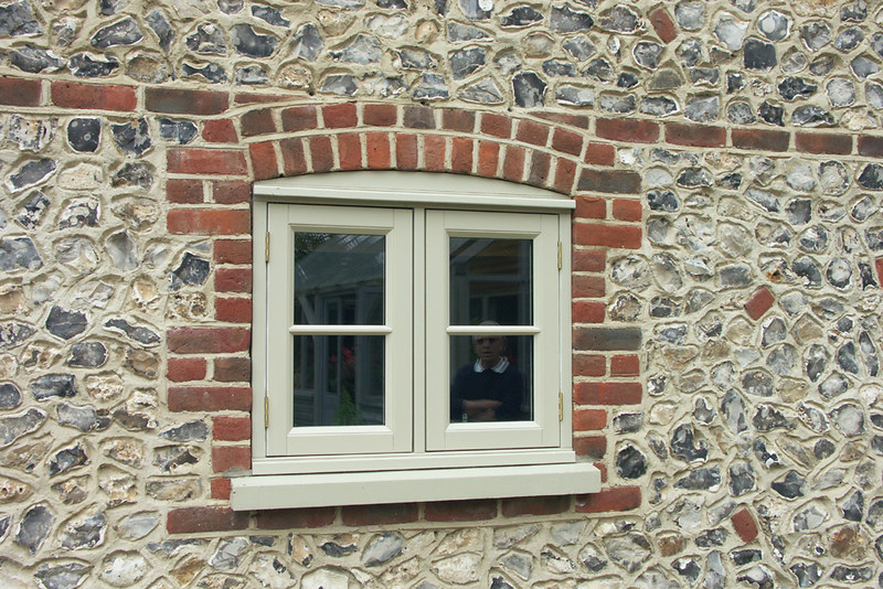 small casement window in a stone wall