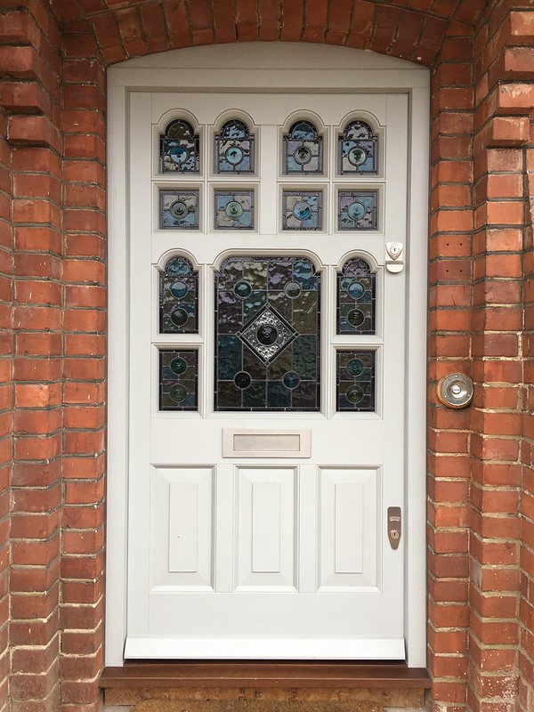 close up of a glass mosaic front door